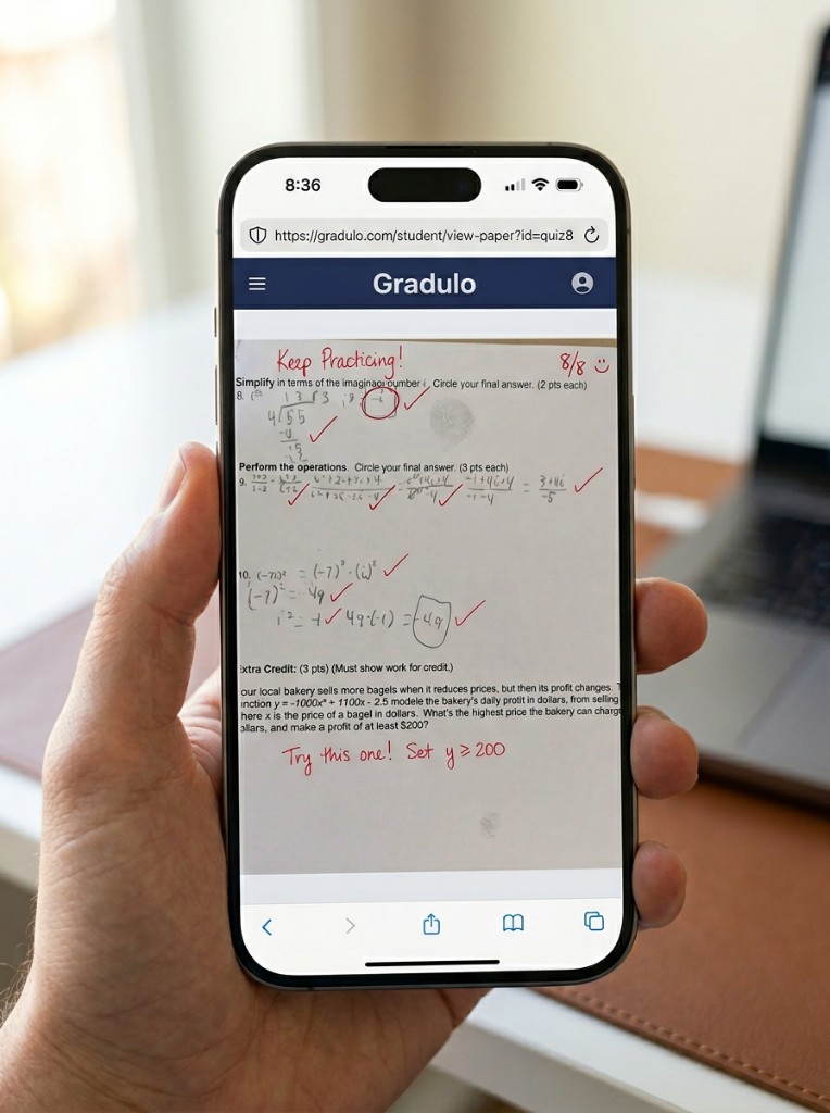 Graded homework on Gradulo: checkmarks, score, and handwritten corrections annotated directly on the worksheet