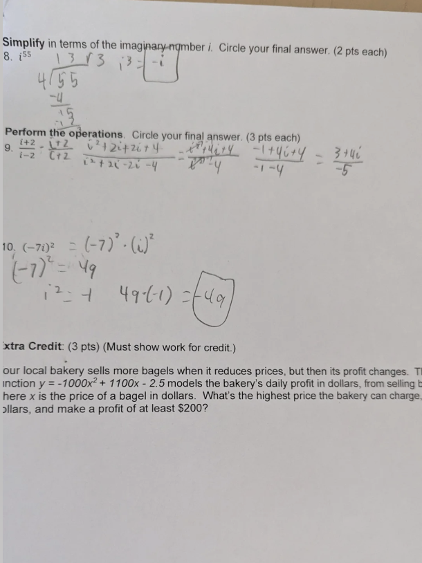 Student homework worksheet before grading — handwritten math work